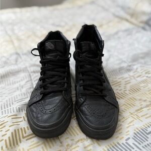 Black High-Top Vans leather sneakers